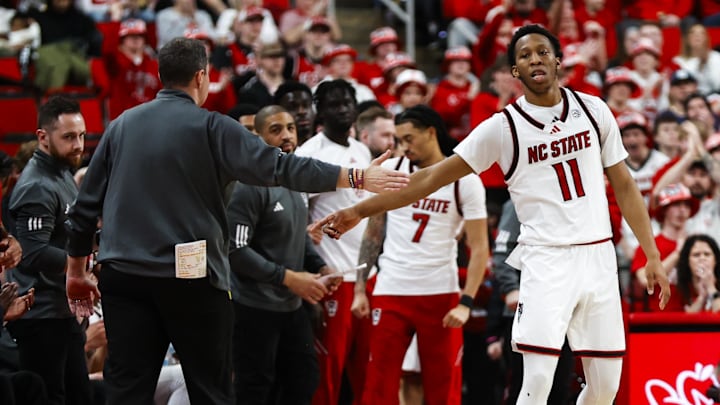 Feb 7, 2026; Raleigh, North Carolina, USA; NC State Wolfpack guard Quadir Copeland (11) and head coach Will Wade react during the second half of the game against the Virginia Tech Hokies at Lenovo Center. Mandatory Credit: Jaylynn Nash-Imagn Images Feb 7, 2026; Raleigh, North Carolina, USA; NC State Wolfpack guard Quadir Copeland (11) and head coach Will Wade react during the second half of the game against the Virginia Tech Hokies at Lenovo Center. Mandatory Credit: Jaylynn Nash-Imagn Images