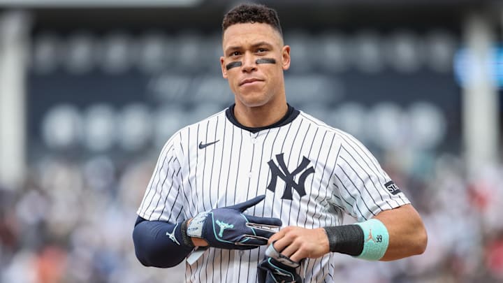 Apr 13, 2025; Bronx, New York, USA;  New York Yankees right fielder Aaron Judge (99) heads back to the field after getting stranded on first base in the seventh inning against the San Francisco Giants at Yankee Stadium
