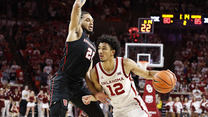 Mar 2, 2024; Norman, Oklahoma, USA; Oklahoma Sooners guard Milos Uzan (12) drives around Houston