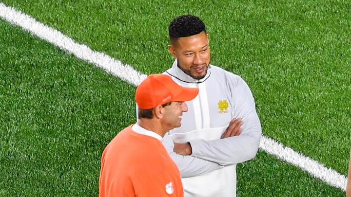 Nov 5, 2022; South Bend, Indiana, USA; Clemson Tigers head coach Dabo Swinney and Notre Dame Fighting Irish head coach Marcus Freeman talk before a game at Notre Dame Stadium.