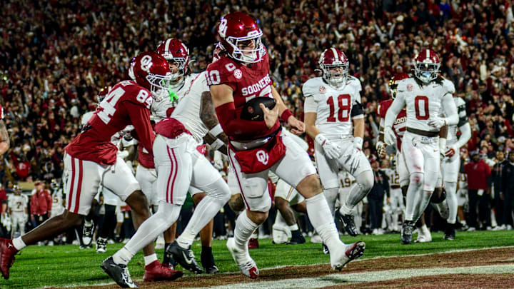 Oklahoma quarterback John Mateer rushes for a touchdown against Alabama in the CFP.
