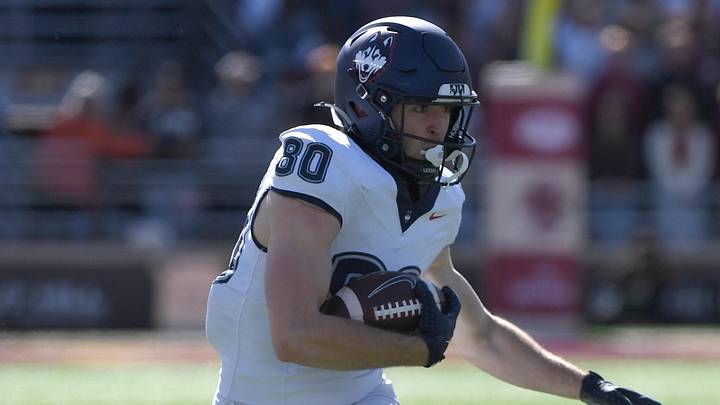 Oct 18, 2025; Chestnut Hill, Massachusetts, USA; UConn Huskies wide receiver John Neider (80) runs with the ball during the first half against the Boston College Eagles at Alumni Stadium. Mandatory Credit: Bob DeChiara-Imagn Images