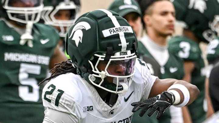 Michigan State's Cam Fancher, right, hands the ball off to Marvis Parrish during the football Spring Showcase on Saturday, April 18, 2026, at Spartan Stadium in East Lansing.