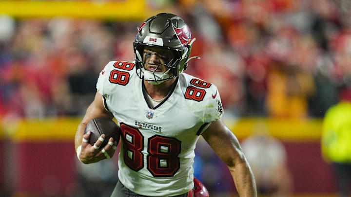 Nov 4, 2024; Kansas City, Missouri, USA; Tampa Bay Buccaneers tight end Cade Otton (88) is tackled by Kansas City Chiefs defensive tackle Tershawn Wharton (98) during the second half at GEHA Field at Arrowhead Stadium. Mandatory Credit: Jay Biggerstaff-Imagn Images