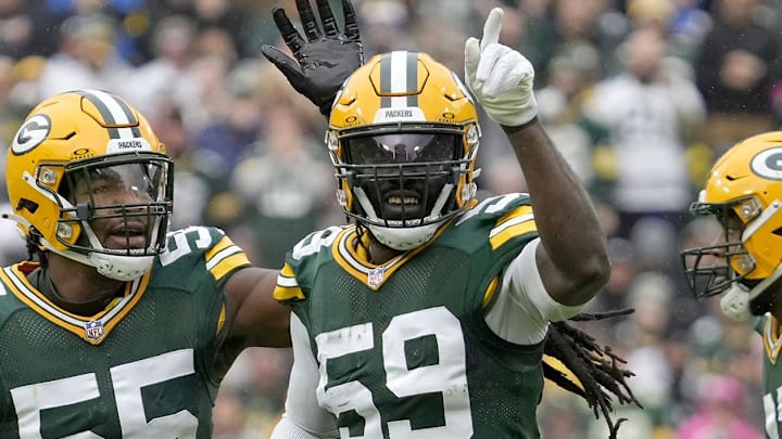 Nov 5, 2023; Green Bay, Wisconsin, USA;  Green Bay Packers linebacker De'Vondre Campbell (59) celebrates a recovered Los Angeles Rams quarterback Brett Rypien (11) fumble with linebacker Kingsley Enagbare (55) during the first quarter at Lambeau Field in Green Bay. Mandatory Credit:  Mike De Sisti USA TODAY Sports
