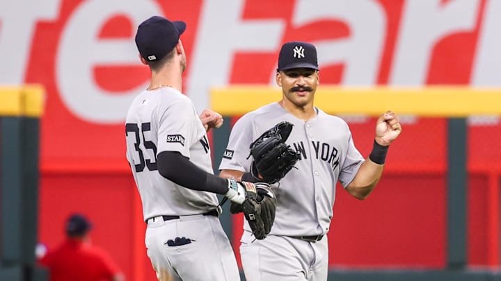 Jul 19, 2025; Atlanta, Georgia, USA; New York Yankees left fielder Cody Bellinger (35) and center fielder Trent Grisham (12) celebrate after a victory over the Atlanta Braves in the ninth inning at Truist Park. Mandatory Credit: Brett Davis-Imagn Images