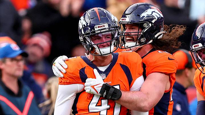 DENVER, CO - DECEMBER 31: Denver Broncos linebacker Drew Sanders (41) celebrates with linebacker Alex Singleton and safety Justin Simmons (31) after stopping a fake punt attempt against the Los Angeles Chargers. DENVER, CO - DECEMBER 31: Denver Broncos linebacker Drew Sanders (41) celebrates with linebacker Alex Singleton and safety Justin Simmons (31) after stopping a fake punt attempt against the Los Angeles Chargers.