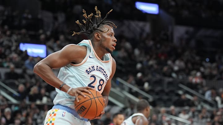 Dec 8, 2024; San Antonio, Texas, USA; San Antonio Spurs center Charles Bassey (28) rebounds in the first half against the New Orleans Pelicans at Frost Bank Center. Dec 8, 2024; San Antonio, Texas, USA; San Antonio Spurs center Charles Bassey (28) rebounds in the first half against the New Orleans Pelicans at Frost Bank Center.