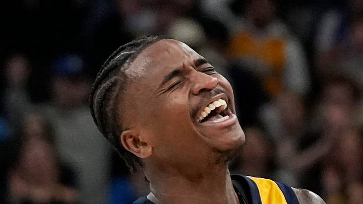 Marquette Golden Eagles guard Kam Jones (1) assists and reacts to the dunk from Marquette Golden Eagles forward Damarius Owens (10) during the second half of the game against Providence on Tuesday February 25, 2025 at Fiserv Forum in Milwaukee, Wis.