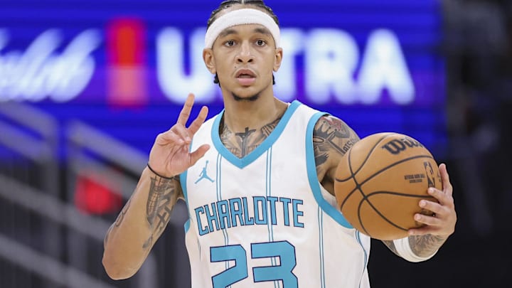 Oct 23, 2024; Houston, Texas, USA; Charlotte Hornets guard Tre Mann (23) brings the ball up the court during the fourth quarter against the Houston Rockets at Toyota Center. Mandatory Credit: Troy Taormina-Imagn Images