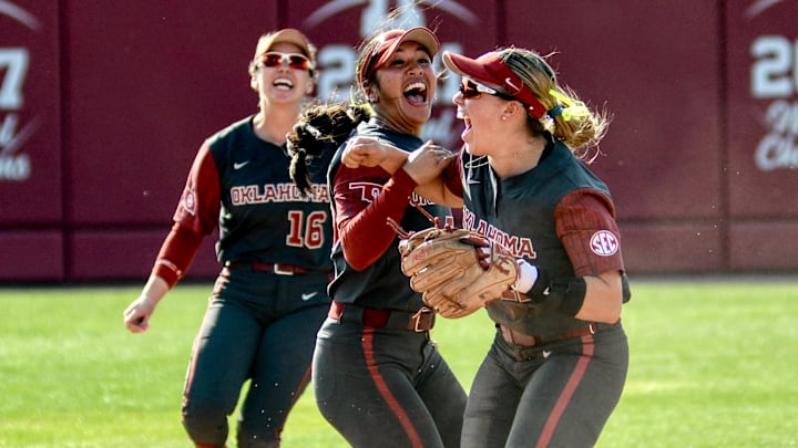 Oklahoma infielder Gabbie Garcia celebrates with Ailana Agbayani after recording a double play against Sam Houston.
