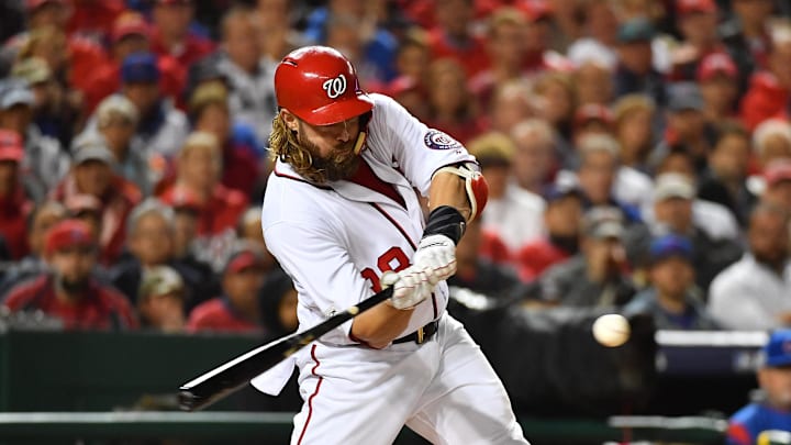 Oct 12, 2017; Washington, DC, USA; Washington Nationals left fielder Jayson Werth (28) hits a SAC fly during the first inning of game five of the 2017 NLDS playoff baseball series against the Chicago Cubs at Nationals Park.