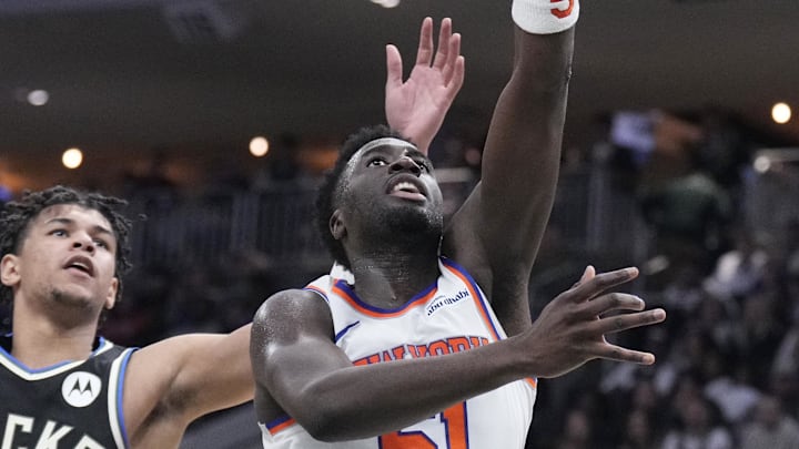 Feb 27, 2026; Milwaukee, Wisconsin, USA;  New York Knicks forward Mohamed Diawara (51) shoots against Milwaukee Bucks forward Ousmane Dieng (21) in the second half at Fiserv Forum. Mandatory Credit: Michael McLoone-Imagn Images