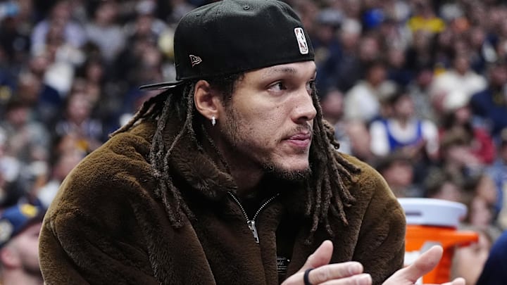 Dec 15, 2025; Denver, Colorado, USA; Denver Nuggets forward Aaron Gordon (50 on the bench during the second quarter against the Houston Rockets at Ball Arena. Mandatory Credit: Ron Chenoy-Imagn Images