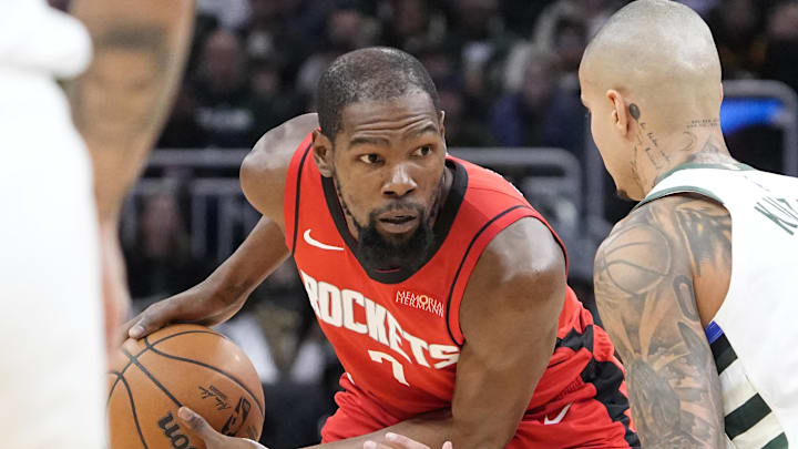 Nov 9, 2025; Milwaukee, Wisconsin, USA; Houston Rockets forward Kevin Durant (7) looks to drive against Milwaukee Bucks forward Kyle Kuzma (18) in the first half at Fiserv Forum. Mandatory Credit: Michael McLoone-Imagn Images