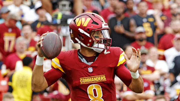 Washington Commanders quarterback Marcus Mariota drops back to make a pass during the first half against the Las Vegas Raiders. Washington Commanders quarterback Marcus Mariota drops back to make a pass during the first half against the Las Vegas Raiders.