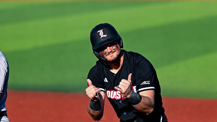 Louisville first baseman Tague Davis celebrates after getting on base against Central Michigan.