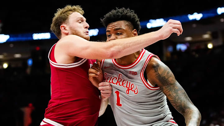 Ohio State Buckeyes forward Amare Bynum (1) dibbles the ball against Indiana Hoosiers forward Tucker Devries (12) in the first half of the NCAA game at Value City Arena on Saturday, March 7, 2026 in Columbus, Ohio.
