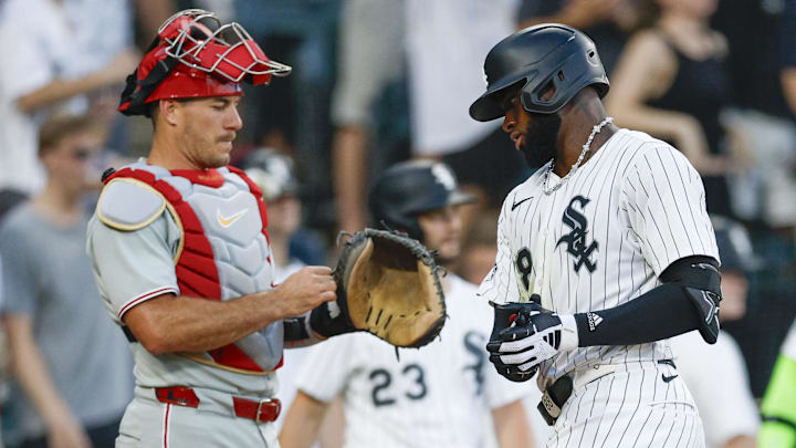 Chicago White Sox center fielder Luis Robert Jr. (88) touches home plate after hitting a two-run home run against the Philadelphia Phillies at Rate Field. 