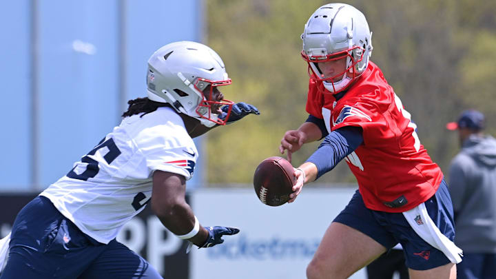 May 11, 2024; Foxborough, MA, USA; New England Patriots quarterback Drake Maye (10) hands the ball