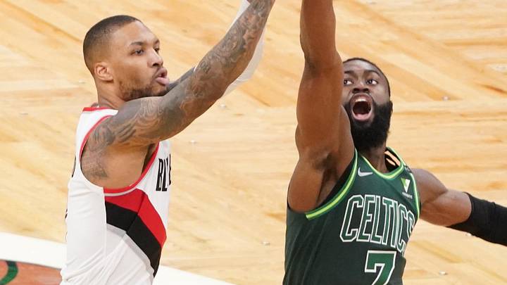 May 2, 2021; Boston, Massachusetts, USA; Portland Trail Blazers guard Damian Lillard (0) shoots against Boston Celtics guard Jaylen Brown (7) in the second quarter at TD Garden. Mandatory Credit: David Butler II-Imagn Images
