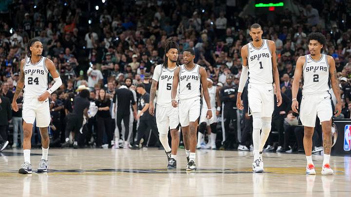 Jun 5, 2026; San Antonio, Texas, USA; San Antonio Spurs guards Stephon Castle (5), De'Aaron Fox (4) and Dylan Harper (2) join forward Devin Vassell (24) and center Victor Wembanyama (1) walking to the bench in the fourth quarter during Game 2 of the 2026 NBA Finals at Frost Bank Center.