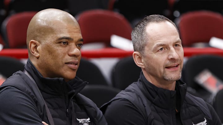 Apr 22, 2022; Chicago, Illinois, USA; Chicago Bulls executive vice president of basketball operations Arturas Karnisovas (right) talks with general manager Marc Eversley (left) before game three of the first round for the 2022 NBA playoffs against the Milwaukee Bucks at United Center. Mandatory Credit: Kamil Krzaczynski-Imagn Images