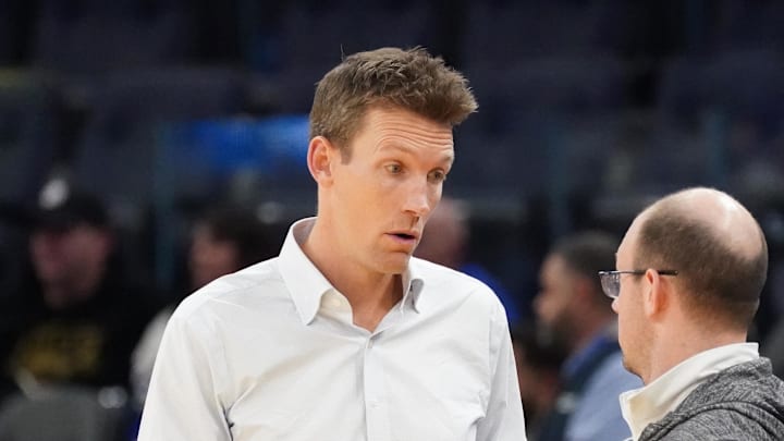 Jan 4, 2025; San Francisco, California, USA;  Golden State Warriors general manager Mike Dunleavy chats before the game against the Memphis Grizzlies at Chase Center. Mandatory Credit: David Gonzales-Imagn Images