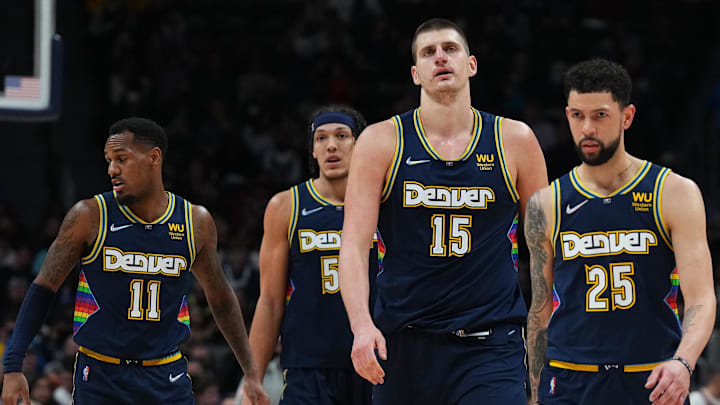 Mar 7, 2022; Denver, Colorado, USA; Denver Nuggets guard Austin Rivers (25) and center Nikola Jokic (15) and forward Aaron Gordon (50) and guard Monte Morris (11) during the fourth quarter at Ball Arena.