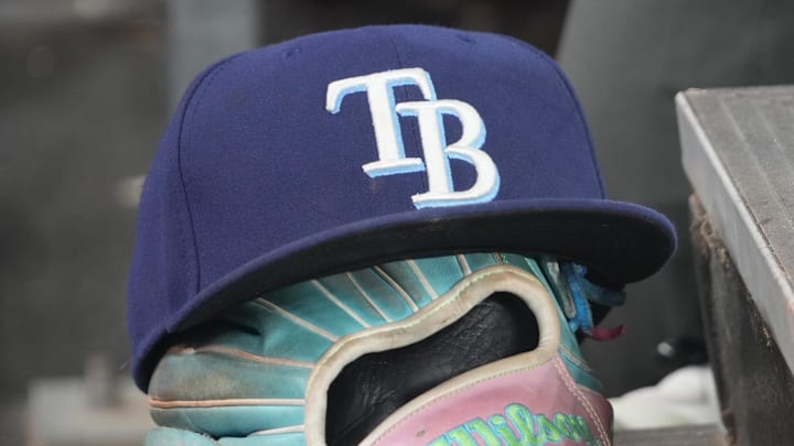 Sep 26, 2025; Toronto, Ontario, CAN; The hat and glove of Tampa Bay Rays third baseman Junior Caminero (13) in the dugout during the game against the Toronto Blue Jays at Rogers Centre. 