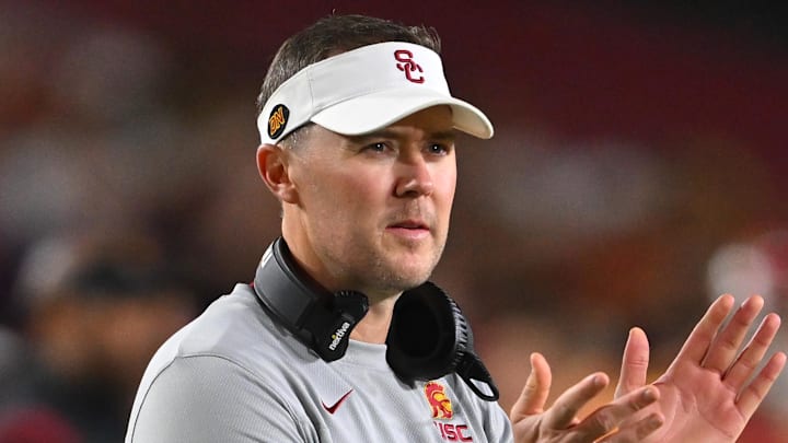 Oct 1, 2022; Los Angeles, California, USA; USC Trojans head coach Lincoln Riley applauds after a touchdown in the first half against the Arizona State Sun Devils at United Airlines Field at the Los Angeles Memorial Coliseum. Mandatory Credit: Jayne Kamin-Oncea-Imagn Images Oct 1, 2022; Los Angeles, California, USA; USC Trojans head coach Lincoln Riley applauds after a touchdown in the first half against the Arizona State Sun Devils at United Airlines Field at the Los Angeles Memorial Coliseum. Mandatory Credit: Jayne Kamin-Oncea-Imagn Images