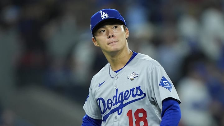 Oct 31, 2025; Toronto, Ontario, CAN; Los Angeles Dodgers pitcher Yoshinobu Yamamoto (18) reacts in the fifth inning against the Toronto Blue Jays during game six of the 2025 MLB World Series at Rogers Centre. Mandatory Credit: John E. Sokolowski-Imagn Images Oct 31, 2025; Toronto, Ontario, CAN; Los Angeles Dodgers pitcher Yoshinobu Yamamoto (18) reacts in the fifth inning against the Toronto Blue Jays during game six of the 2025 MLB World Series at Rogers Centre. Mandatory Credit: John E. Sokolowski-Imagn Images