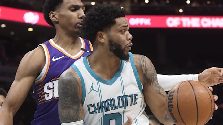 Jan 7, 2025; Charlotte, North Carolina, USA;  Charlotte Hornets forward Miles Bridges (0) catches a pass during the first half against the Phoenix Suns at the Spectrum Center. Mandatory Credit: Sam Sharpe-Imagn Images