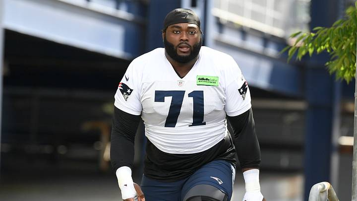 Jul 30, 2022; Foxborough, MA, USA; New England Patriots guard Mike Onwenu (71) walks to the practice field at the Patriots training camp at Gillette Stadium. Mandatory Credit: Eric Canha-USA TODAY Sports Jul 30, 2022; Foxborough, MA, USA; New England Patriots guard Mike Onwenu (71) walks to the practice field at the Patriots training camp at Gillette Stadium. Mandatory Credit: Eric Canha-USA TODAY Sports