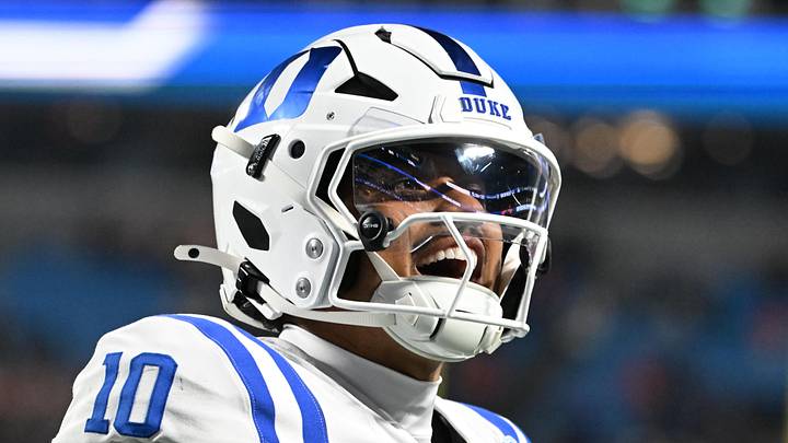 Dec 6, 2025; Charlotte, NC, USA; Duke Blue Devils quarterback Darian Mensah (10) celebrates after the Blue Devils score a touchdown in overtime during the ACC Championship game at Bank of America Stadium. Mandatory Credit: Bob Donnan-Imagn Images Dec 6, 2025; Charlotte, NC, USA; Duke Blue Devils quarterback Darian Mensah (10) celebrates after the Blue Devils score a touchdown in overtime during the ACC Championship game at Bank of America Stadium. Mandatory Credit: Bob Donnan-Imagn Images
