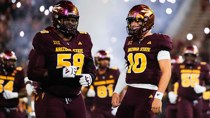 Sep 13, 2025; Tempe, Arizona, USA;   Arizona State Sun Devils quarterback Sam Leavitt (10) and Arizona State Sun Devils offensive lineman Max Iheanachor (58) during runout at Mountain America Stadium against the Texas State Bobcats. Mandatory Credit: Arianna Grainey-Imagn Images