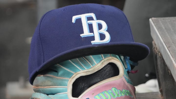 Sep 26, 2025; Toronto, Ontario, CAN; The hat and glove of Tampa Bay Rays third baseman Junior Caminero (13) in the dugout during the game against the Toronto Blue Jays at Rogers Centre. Sep 26, 2025; Toronto, Ontario, CAN; The hat and glove of Tampa Bay Rays third baseman Junior Caminero (13) in the dugout during the game against the Toronto Blue Jays at Rogers Centre.