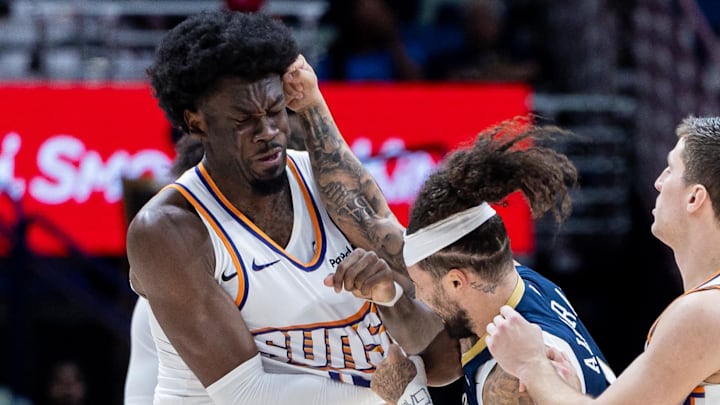 Dec 27, 2025; New Orleans, Louisiana, USA;  New Orleans Pelicans guard Jose Alvarado (15) gets into a scrum with Phoenix Suns center Mark Williams (15) over a play during the second half at Smoothie King Center. Mandatory Credit: Stephen Lew-Imagn Images