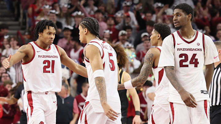 Arkansas Razorbacks guard D.J. Wagner (21) celebrates with teammates after a play as wing Billy Richmond III (24) looks on during the second half against the Missouri Tigers at Bud Walton Arena.