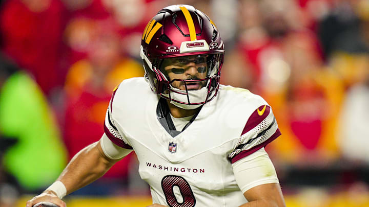 Oct 27, 2025; Kansas City, Missouri, USA; Washington Commanders quarterback Marcus Mariota (8) rolls out to pass during the first half against the Kansas City Chiefs at GEHA Field at Arrowhead Stadium. Mandatory Credit: Jay Biggerstaff-Imagn Images