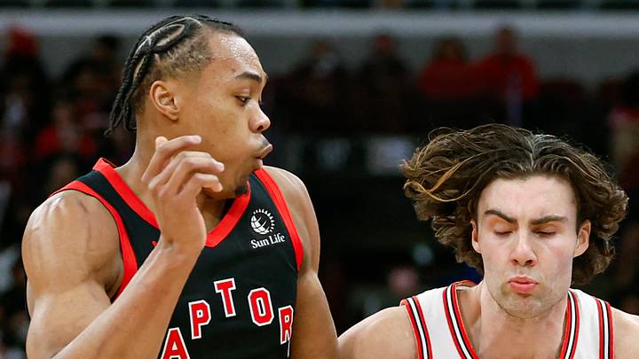 Chicago Bulls guard Josh Giddey drives to the basket against Toronto Raptors forward Scottie Barnes. Chicago Bulls guard Josh Giddey drives to the basket against Toronto Raptors forward Scottie Barnes.