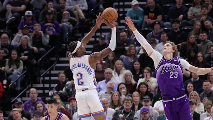 Jan 18, 2024; Salt Lake City, Utah, USA; Oklahoma City Thunder guard Shai Gilgeous-Alexander (2) shoots the ball past Utah Jazz forward Lauri Markkanen (23) during the second half at Delta Center. Mandatory Credit: Chris Nicoll-Imagn Images Jan 18, 2024; Salt Lake City, Utah, USA; Oklahoma City Thunder guard Shai Gilgeous-Alexander (2) shoots the ball past Utah Jazz forward Lauri Markkanen (23) during the second half at Delta Center. Mandatory Credit: Chris Nicoll-Imagn Images