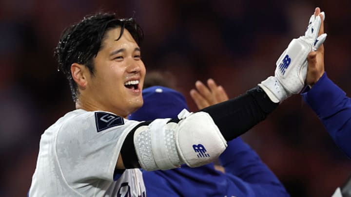 Los Angeles Dodgers designated hitter Shohei Ohtani celebrates hitting a walk-off home run.