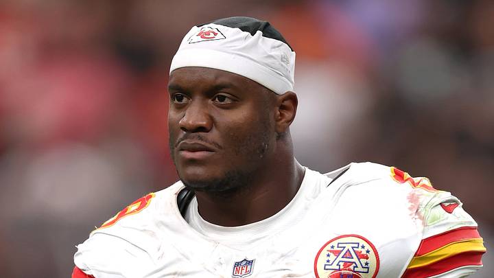 Kansas City Chiefs running back Kenneth Walker III (9) walks off the field holding his helmet 