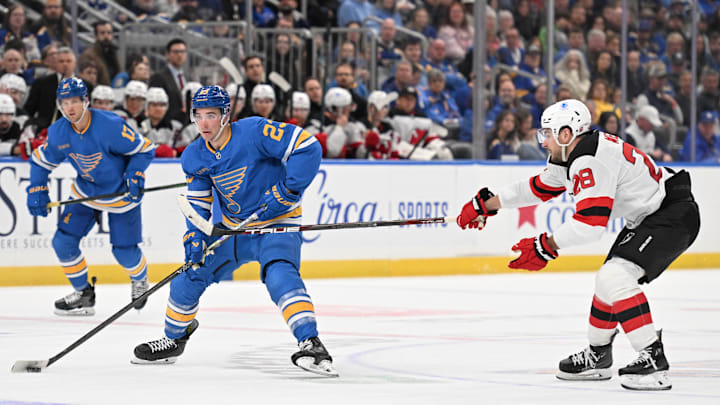 Feb 28, 2026; St. Louis, Missouri, USA; New Jersey Devils right wing Timo Meier (28) pressures St. Louis Blues defenseman Logan Mailloux (23) in the second period at Enterprise Center. Mandatory Credit: Joe Puetz-Imagn Images