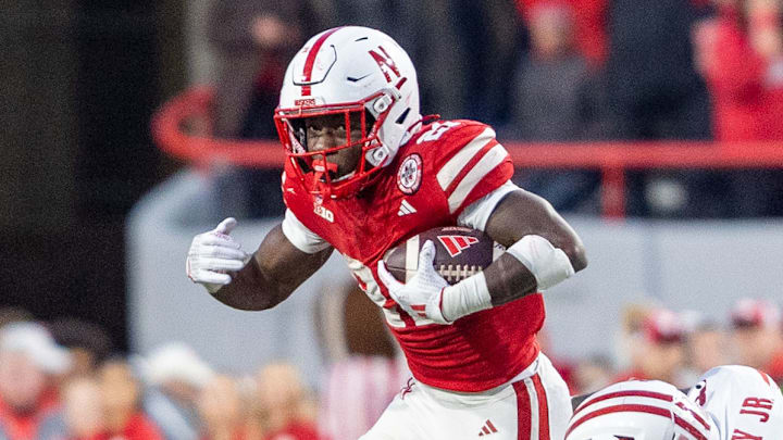 Nebraska running back Emmett Johnson runs for a short fourth quarter gain against Wisconsin. Nebraska running back Emmett Johnson runs for a short fourth quarter gain against Wisconsin.