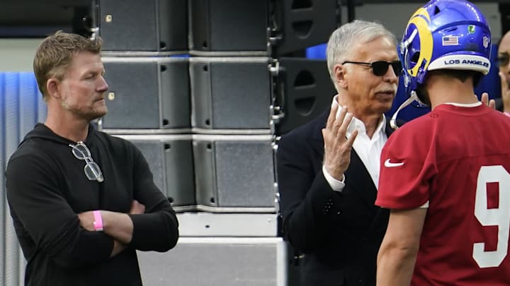 Jun 10, 2021; Los Angeles, CA, USA; Los Angeles Rams owner Stan Kroenke (center) talks to quarterback Matthew Stafford (9) before the start of an offseason workout SoFi Stadium. Left is team general manager Les Snead. Mandatory Credit: Robert Hanashiro-Imagn Images