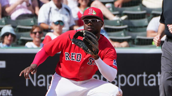 Feb 26, 2026; Fort Myers, Florida, USA; Tampa Bay Rays’ Raynel Delgado (73) steals third base against Boston Red Sox infielder Andruw Monasterio (32) during the fifth inning at JetBlue Park at Fenway South. Mandatory Credit: Jim Rassol-Imagn Images
