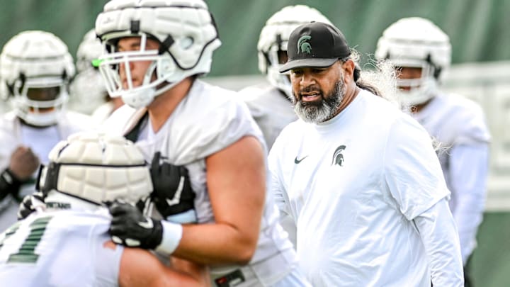 Michigan State's defensive line coach Legi Suiaunoa works with players during the first day of football camp on Tuesday, July 30, 2024, in East Lansing.