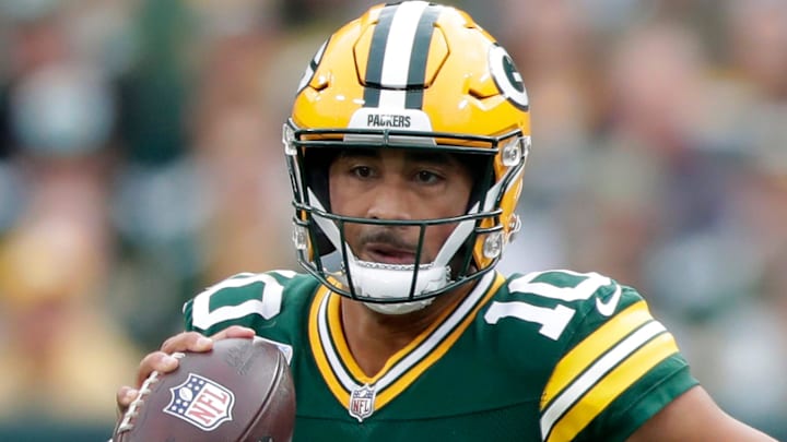 Green Bay Packers quarterback Jordan Love runs with the ball against the Cincinnati Bengals.
